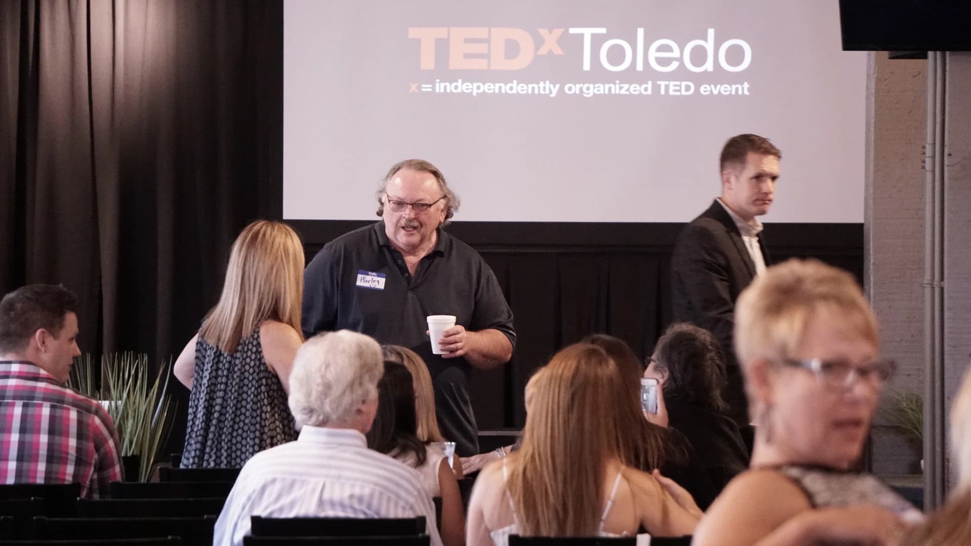 TEDxToledo attendees sharing a conversation between talks in 2017