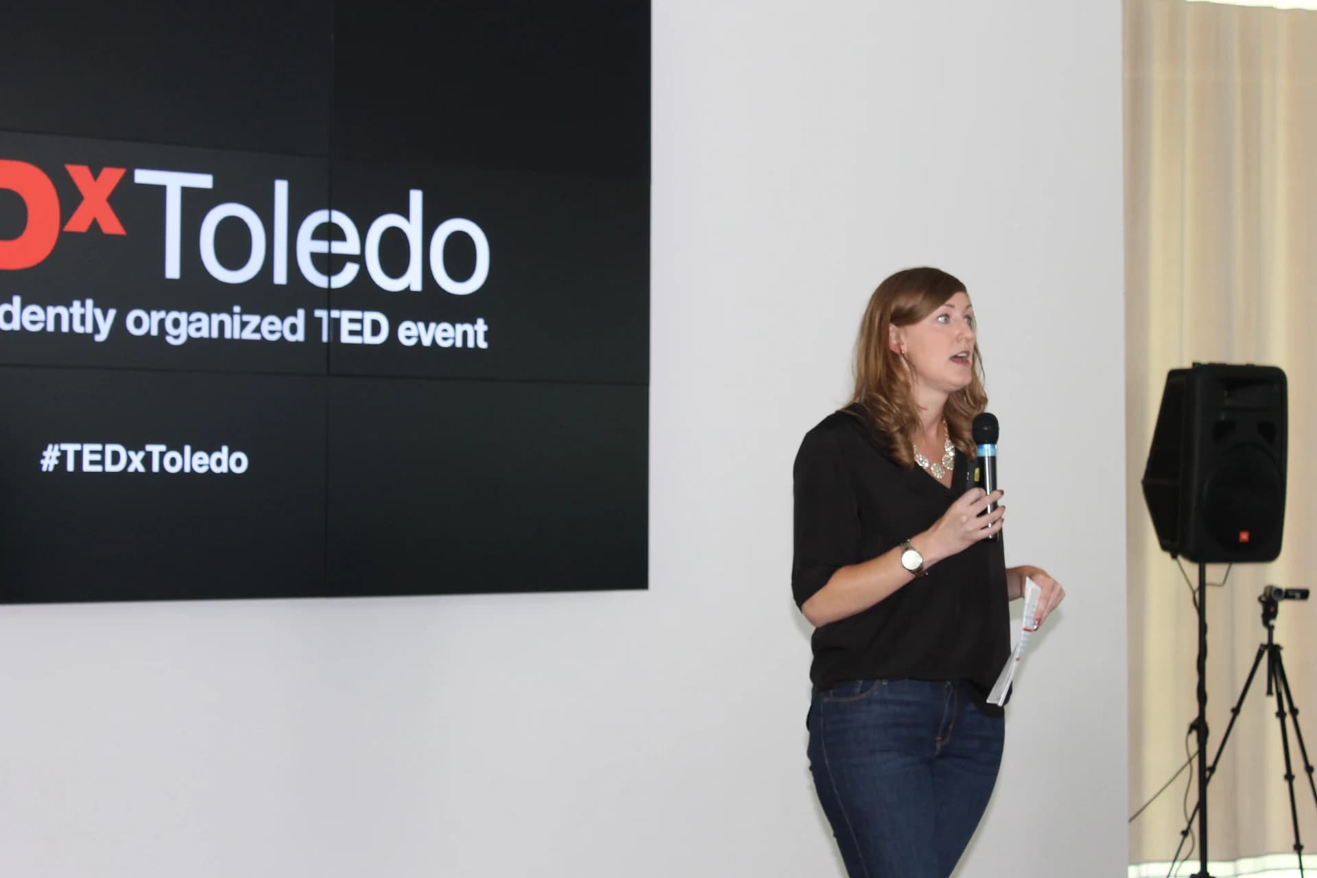 Co-organizer Molly Luetke speaking at TEDxToledo in 2016